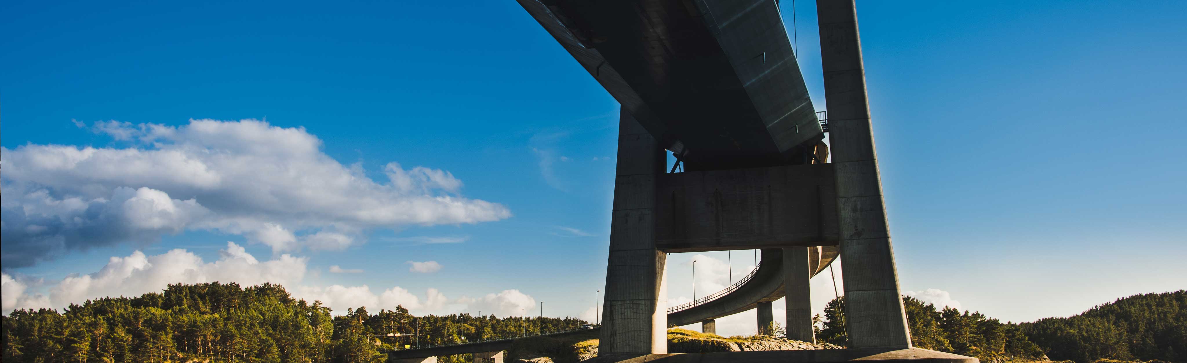 A photo of a bridge on a sunny day.